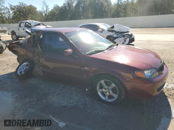 ✅ 2003 Mazda Protege DX • VIN: JM1BJ225730118870 • Lot: 81490454. Wystawiony na Copart z przebiegiem 100 026 mil. Bezpłatny archiwum sprzedaży aukcyjnych z USA i szczegółowy raport historii pojazdu na DreamBid. Zdjęcie 4.