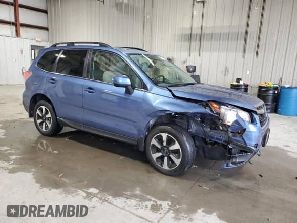 2017 Subaru Forester Limited with VIN JF2SJAJC5HH527843, listed as a Copart auction lot 82440135 with 64,197 mi miles and Salvage title. Bid and sale history available at DreamBid. Image 4.