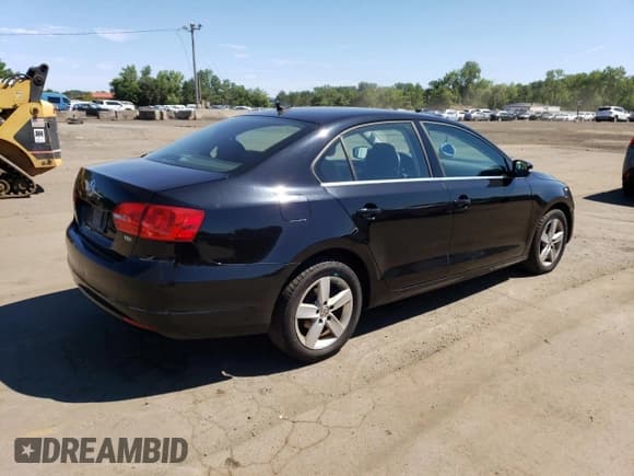 ✅ 2013 Volkswagen Jetta TDI w/Premium/Nav • VIN: 3VW3L7AJ7DM376098 • Lot: 65588905. Listed on Copart with 178,910 mi. Free auction sales archive from the USA and detailed vehicle history report at DreamBid. Image 3.