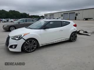 2016 Hyundai Veloster Turbo z VIN KMHTC6AE9GU293039, wystawiony jako Copart lot #69986755 z przebiegiem 93 522 mil mil oraz Szkoda całkowita • Salvage title. Historia ofert i sprzedaży dostępna na DreamBid. Obrazek 1.