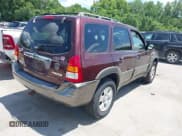 ✅ 2001 Mazda Tribute LX • VIN: 4F2YU081X1KM40012 • Lot: 42569557. Listed on IAAI with 228,754 mi. Free auction sales archive from the USA and detailed vehicle history report at DreamBid. Image 4.