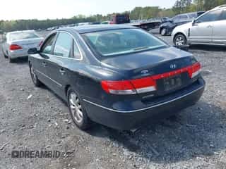 2006 Hyundai Azera SE z VIN KMHFC46FX6A117832, wystawiony jako IAAI lot #41903278 z przebiegiem 138 987 mil mil oraz . Historia ofert i sprzedaży dostępna na DreamBid. Obrazek 3.