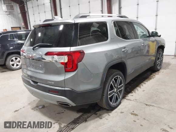 ✅ 2023 GMC Acadia SLT • VIN: 1GKKNULS1PZ191310 • Lot: 43578298. Listed on IAAI with 48,593 mi. Free auction sales archive from the USA and detailed vehicle history report at DreamBid. Image 4.