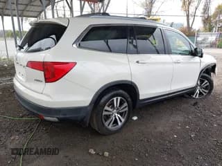 ✅ 2018 Honda Pilot EX-L • VIN: 5FNYF6H59JB057031 • Lot: 43586981. Listed on IAAI with 163,632 mi. Free auction sales archive from the USA and detailed vehicle history report at DreamBid. Image 4.