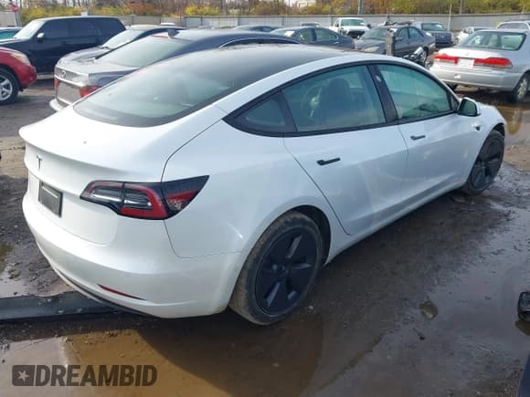 ✅ 2021 Tesla Model 3 Standard Range Plus • VIN: 5YJ3E1EA6MF063651 • Lot: 43740013. Listed on IAAI with 40,152 mi. Free auction sales archive from the USA and detailed vehicle history report at DreamBid. Image 4.