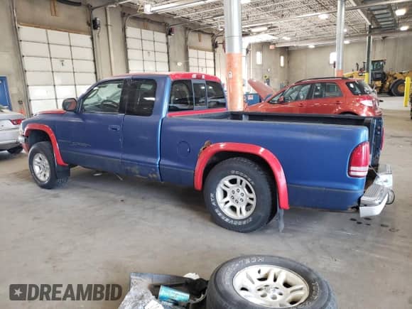2001 Dodge Dakota Sport z VIN 1B7GG22N11S308590, wystawiony jako Copart lot #72035684 z przebiegiem 149 450 mil mil oraz Czysty tytuł • Clean title. Historia ofert i sprzedaży dostępna na DreamBid. Obrazek 2.