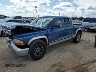 2002 Dodge Dakota SLT с VIN 1B7HL48N12S716124, выставлен на аукционе Copart как лот 84445315 с пробегом 198 113 миль миль и Списание • Salvage title. История ставок и продаж доступна на DreamBid. Изображение 1.