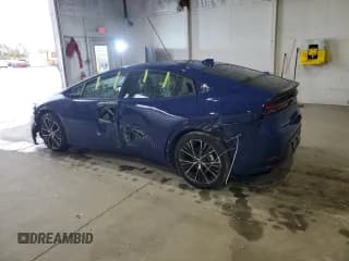 ✅ 2025 Toyota Prius LE • VIN: JTDACAAU9S3056815 • Лот: 89881605. Опубликован ранее на Copart с пробегом 6 699 миль. Бесплатный доступ к архиву аукционных продаж из США и подробный отчёт об истории автомобиля на DreamBid. Изображение 2.