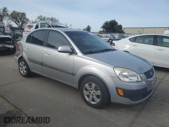 ✅ 2007 Kia Rio LX • VIN: KNADE123876239834 • Lot: 49729285. Listed on Copart with 212,774 mi. Free auction sales archive from the USA and detailed vehicle history report at DreamBid. Image 4.