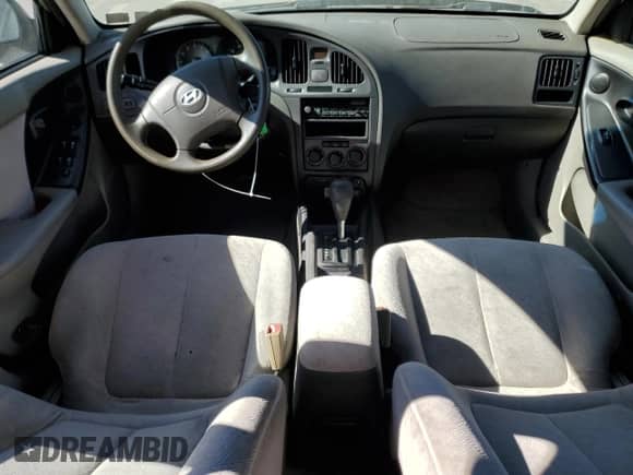 2005 Hyundai Elantra GLS с VIN KMHDN56D15U165884, выставлен на аукционе Copart как лот 76566484 с пробегом Не указан миль и Списание • Salvage title. История ставок и продаж доступна на DreamBid. Изображение 8.