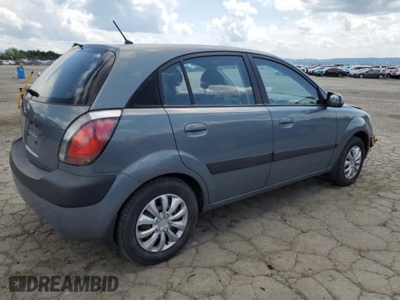 ✅ 2009 Kia Rio LX • VIN: KNADE243X96531829 • Лот: 61533975. Опубликован ранее на Copart с пробегом 202 187 миль. Бесплатный доступ к архиву аукционных продаж из США и подробный отчёт об истории автомобиля на DreamBid. Изображение 3.