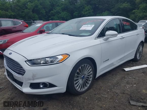 ✅ 2013 Ford Fusion Titanium Hybrid • VIN: 3FA6P0RU6DR315585 • Lot: 42598359. Listed on IAAI with 153,669 mi. Free auction sales archive from the USA and detailed vehicle history report at DreamBid. Image 2.