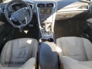 ✅ 2016 Ford Fusion Titanium Hybrid • VIN: 3FA6P0RU0GR102720 • Lot: 87400675. Listed on Copart with 113,751 mi. Free auction sales archive from the USA and detailed vehicle history report at DreamBid. Image 8.