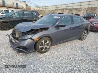 ✅ 2019 Honda Civic LX • VIN: 19XFC2F65KE022434 • Lot: 71771245. Listed on Copart with 67,177 mi. Free auction sales archive from the USA and detailed vehicle history report at DreamBid. Image 1.