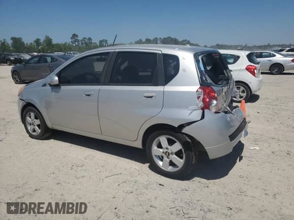 2009 Chevrolet Aveo 1LT with VIN KL1TD66E09B338773, listed as a Copart auction lot 52575765 with 102,617 mi miles and Salvage title. Bid and sale history available at DreamBid. Image 2.