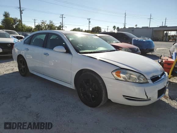 ✅ 2013 Chevrolet Impala LTZ • VIN: 2G1WC5E38D1215761 • Lot: 90534035. Listed on Copart with 205,467 mi. Free auction sales archive from the USA and detailed vehicle history report at DreamBid. Image 4.