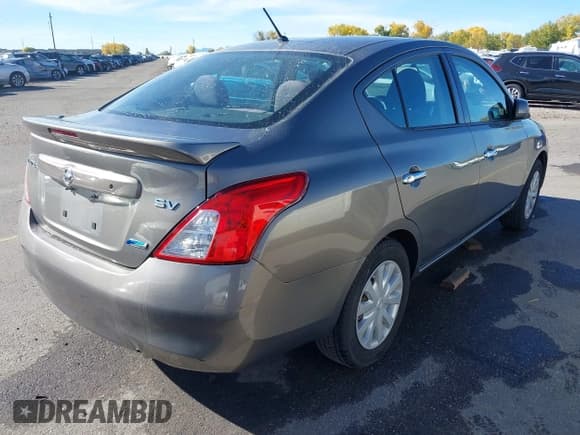 ✅ 2014 Nissan Versa SV • VIN: 3N1CN7AP4EL807590 • Lot: 43526051. Listed on IAAI with 134,190 mi. Free auction sales archive from the USA and detailed vehicle history report at DreamBid. Image 4.